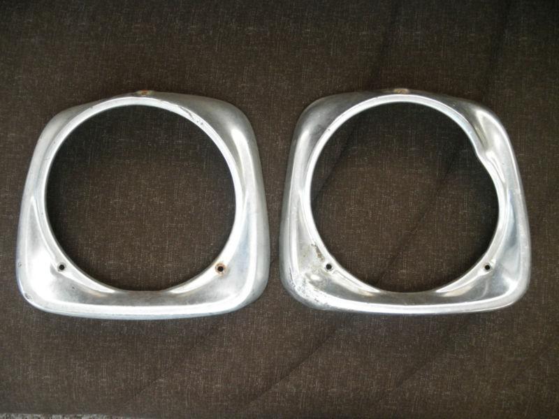 Vintage ford f-100 aluminum head light bezel frame holders set of two(2)