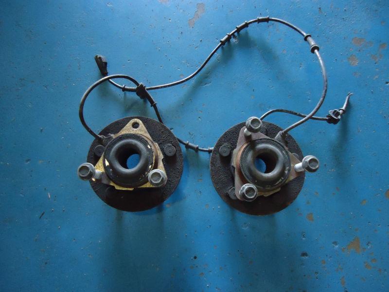 Pair of oem front hub assy from '03 dodge ram 1500 2wd 