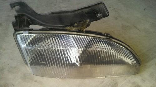 95-99 chevrolet cavalier right (passenger) headlight assembly - oem - used