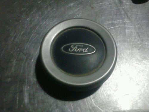 A ford steering wheel center from a ford fire truck