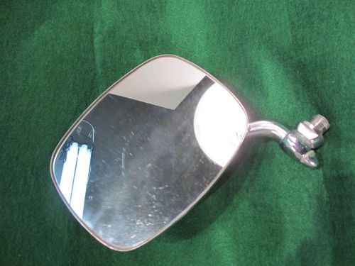 Old/antique automotive side view mirror.  chrome.