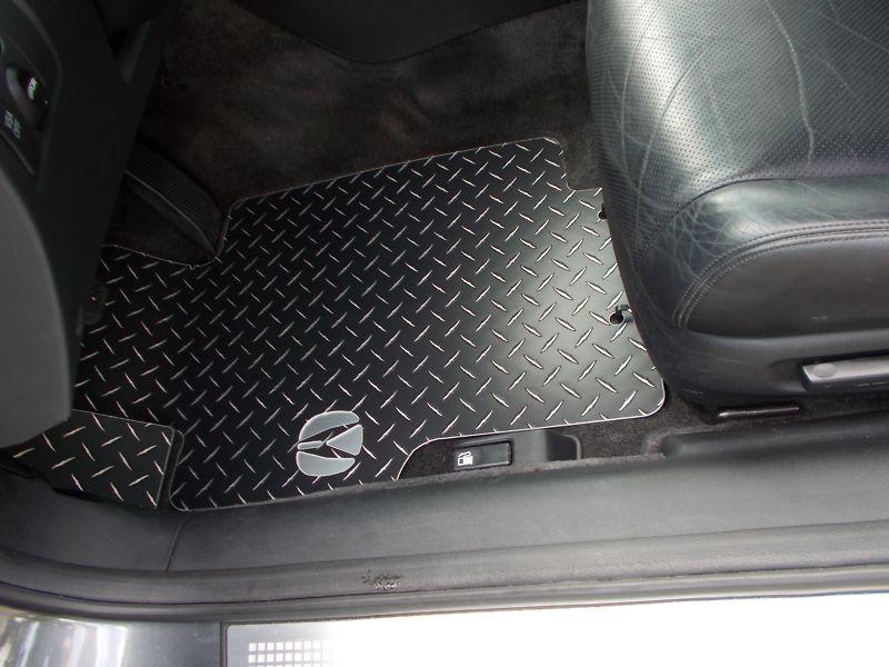 Tl black with exposed metal/silver diamond floor mats.  custom shaped set of 4