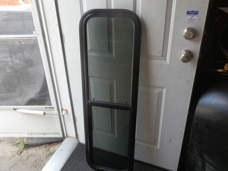 Rv black tinted up & down window r.o. 48" x 14" ( used )