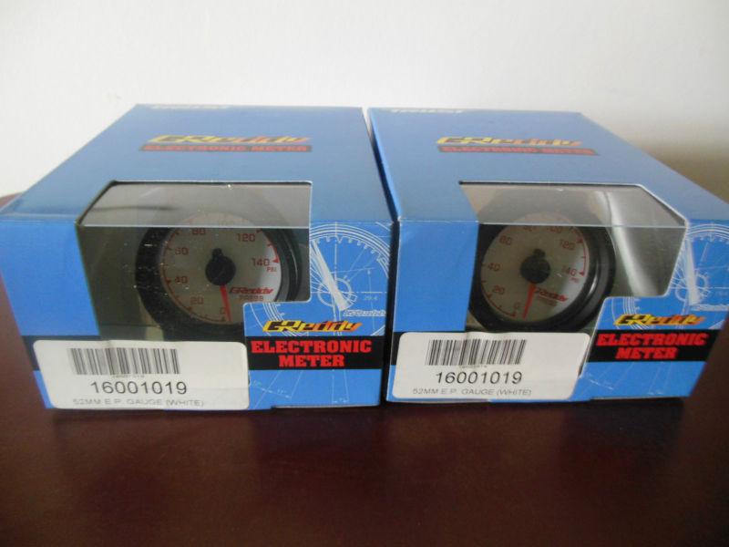 2 brand new greddy oil/fuel pressure gauges 52mm white face nib