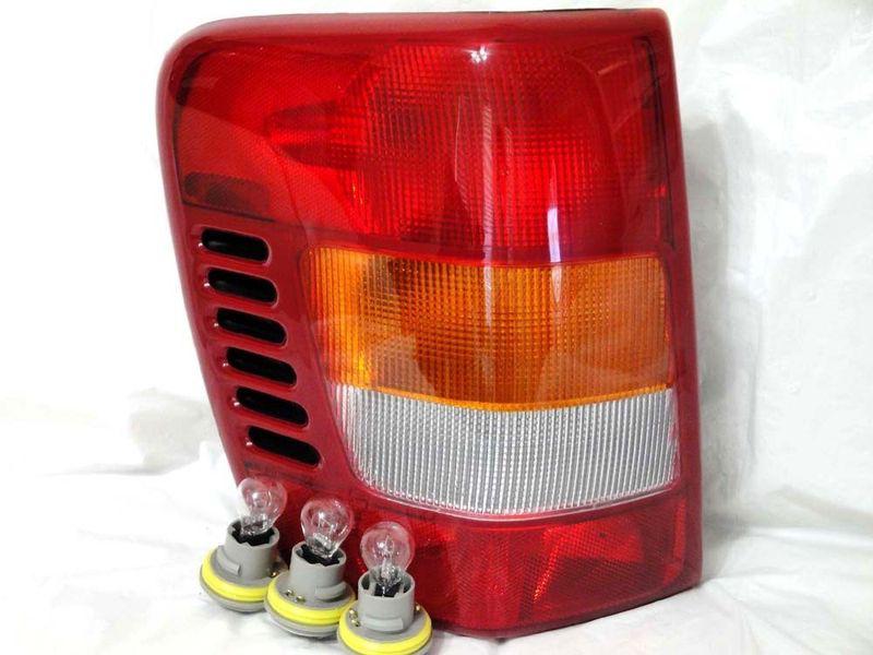 W/3 light bulbs/sockets 99-01 jeep grand cherokee rear tail light lamp l h new