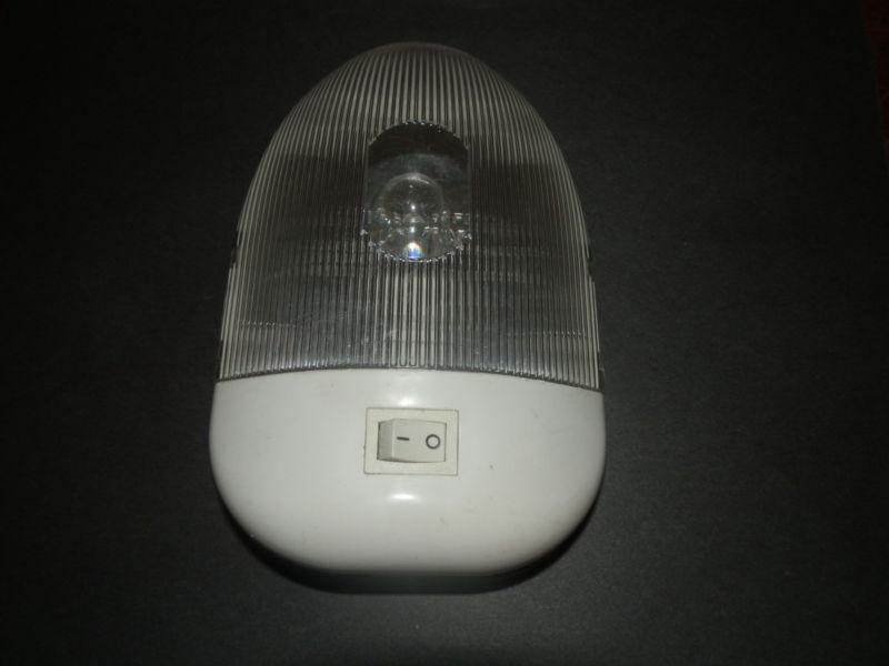 12 volt single light with clear cover ( used )