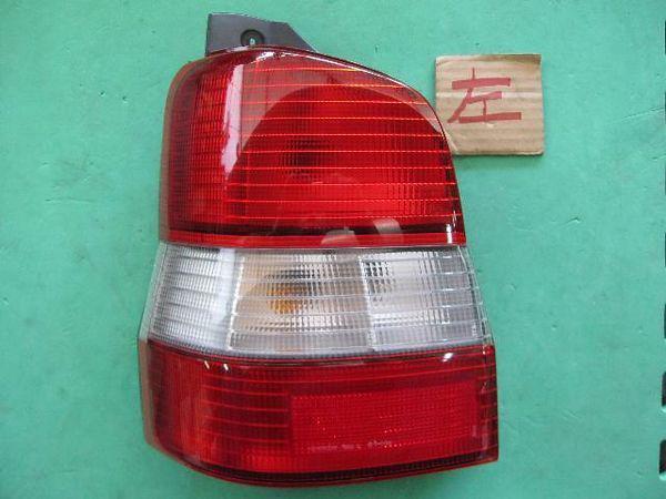 Mazda demio 1998 rear left combination lamp [0615600]