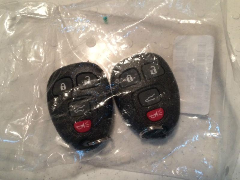 New gm genuine oem keyless entry transmitter fob rke 20952746 pair (x2!)