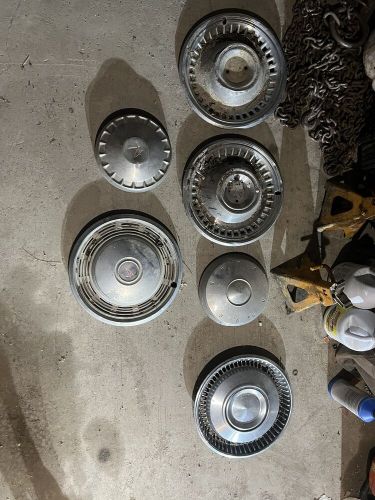 Lot of vintage hubcaps