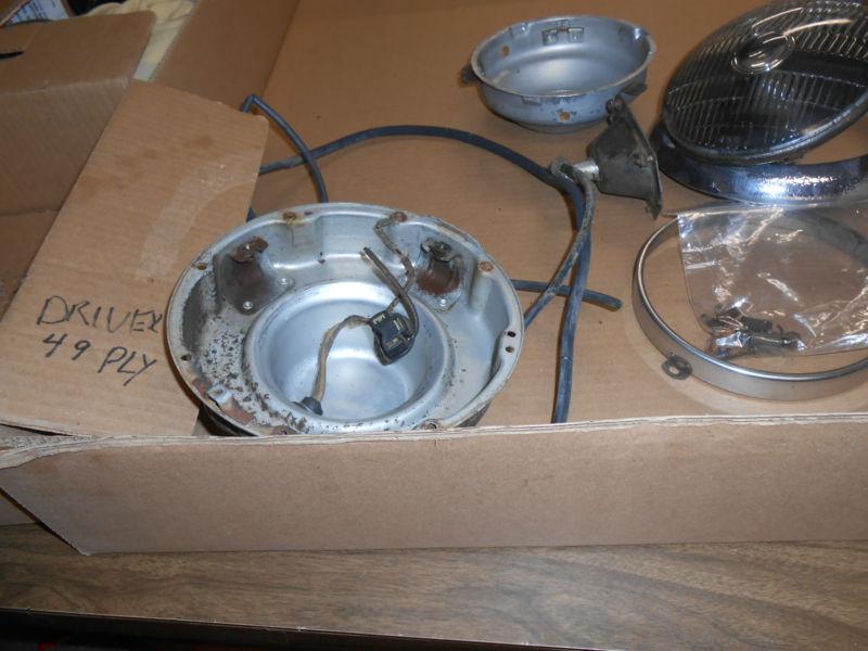 1949 plymouth driver side headlight bucket assembly