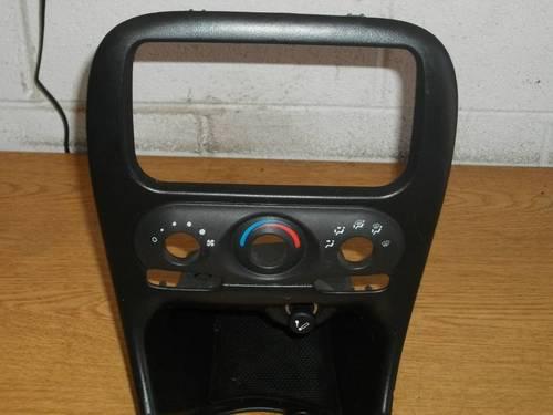 99-04 alero center dash bezel black radio/climate control trim w/lighter oem