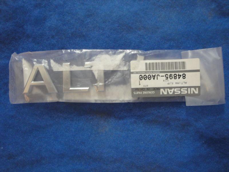 Nissan genuine oem factory trunk lid nameplate 84895ja000 