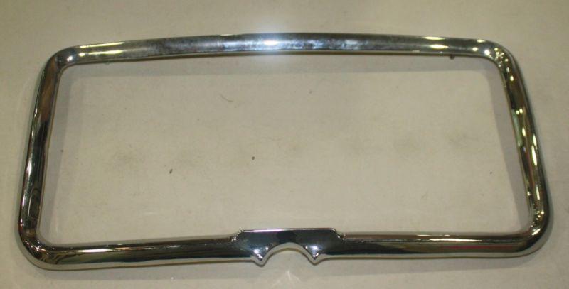 1957-58 license plate surround moulding rechromed