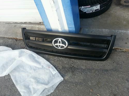 Oem grill new black with chrome emblem for a tundra