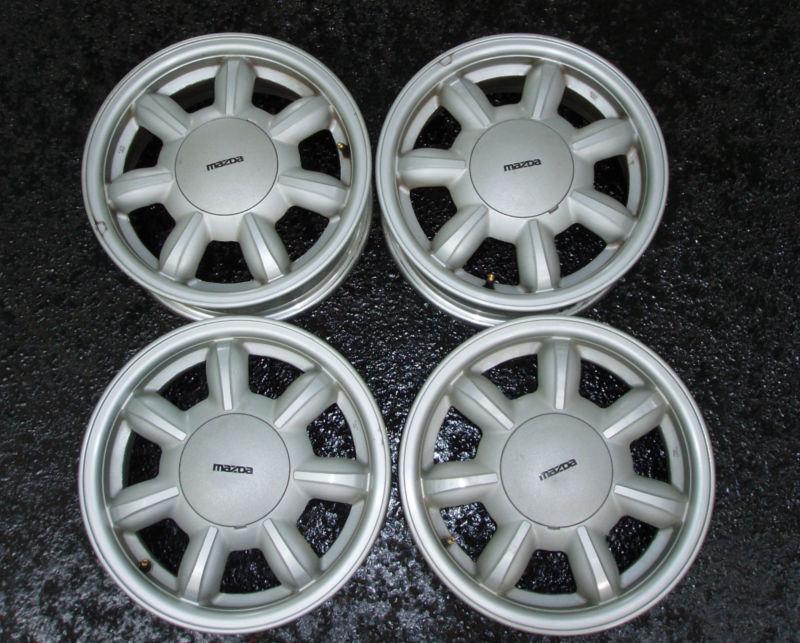 Set of four mazda miata oem 14 inch alloy wheels - nice no rash