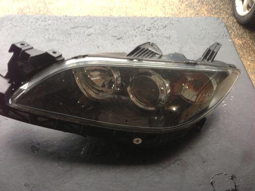 04-09 mazda 3 left halogen oem