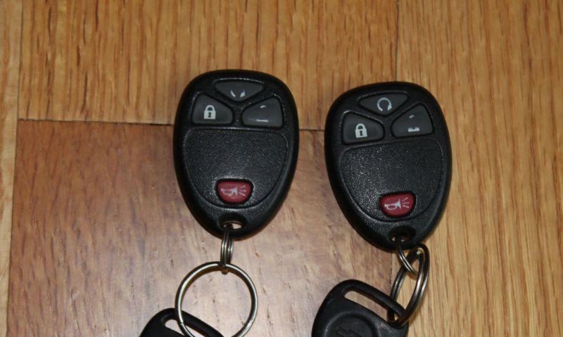 Pair gm chevy saturn buick keyless entry remote key fob transmitter clicker used