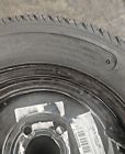 225/55-12 loadstar k399 10 ply trailer tire mounted on 12x7 black steel wheel