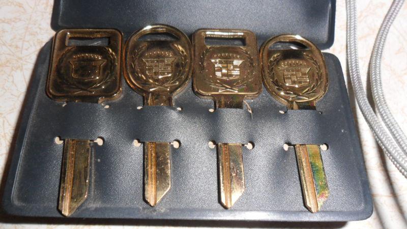 Cadillac keys -- four - 4 - vintage gold double crest  cadillac blank keys