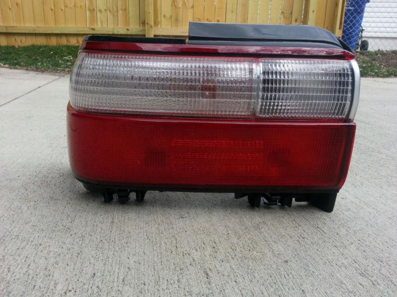 Left driver side replacement tail light lamp 96-97 toyota corolla 4dr 8156002060