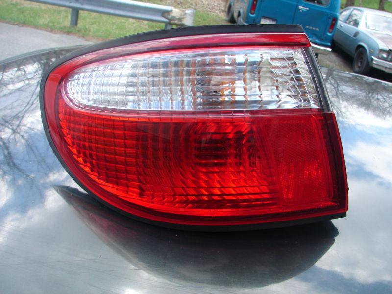 1999 00 millenia tail light outer cnr or qtr mounted lh