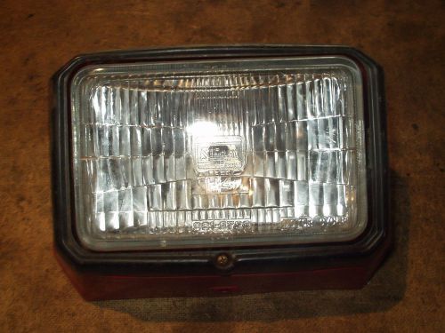 Headlight and housing / case 1984 honda 200x h49