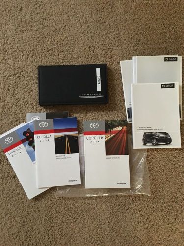 Lot 3 new owner&#039;s manuals 2014 corolla, 2015 chrysler 200 &amp; smart car