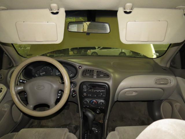 2003 oldsmobile alero floor center console tan 2562416