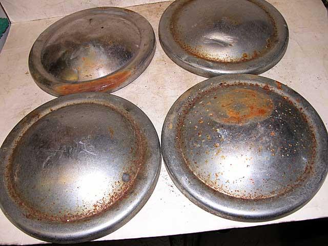 Mg mga set of four (4) original hub caps used 2 very good 2 dinged