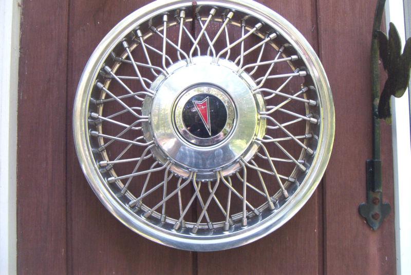 Oe 14 inch wire wheelcover, 1987-88 pontiac 6000 with emblem # 5090 excellent