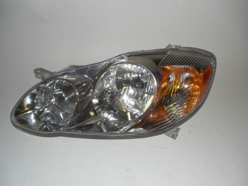 03 04 toyota corolla left headlight nice!