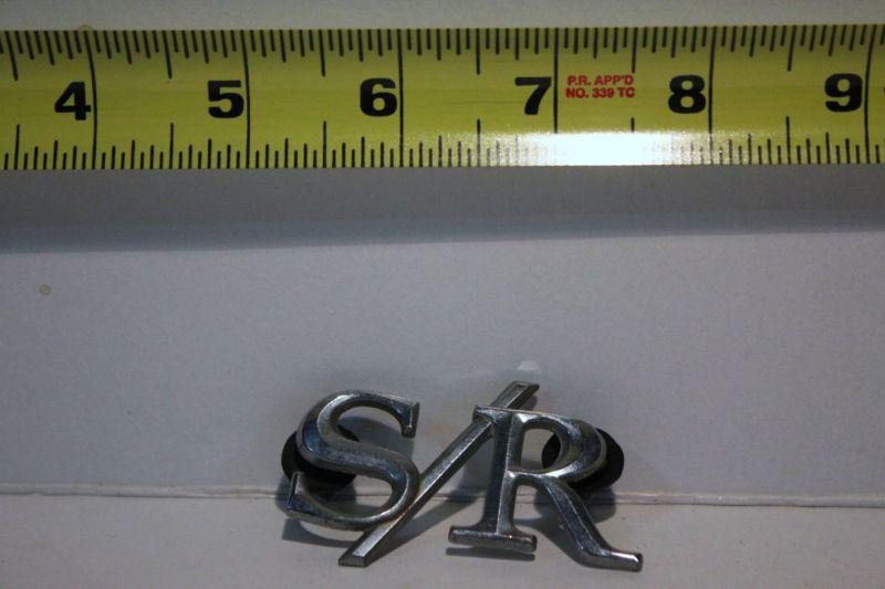 Old car emblem s/r unknown car removed from junked car many years ago initials
