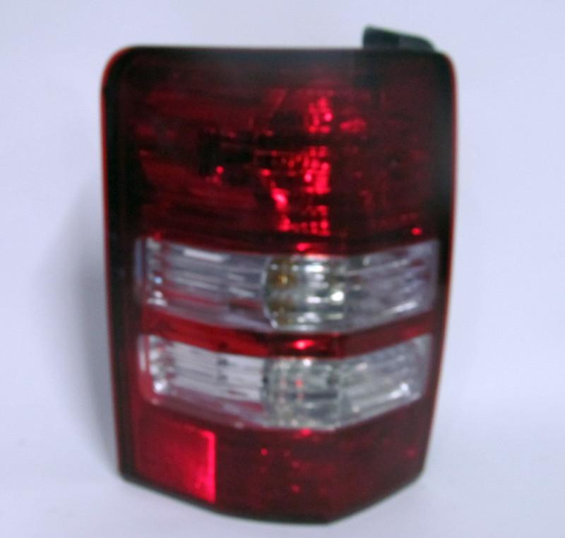 08 09 2010 2011 2012 jeep liberty oem left tail light nice!