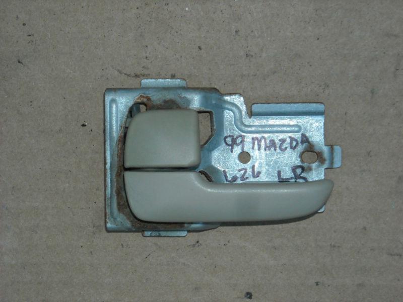 99 mazda 626 lx inside door handle l/r