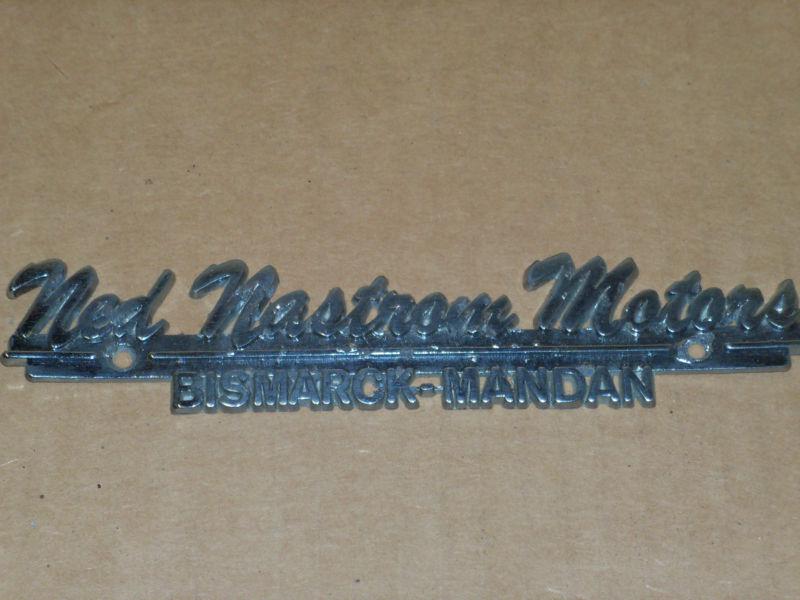 Car dealer metal script emblem -- ned nastrom motors - bismark, nd