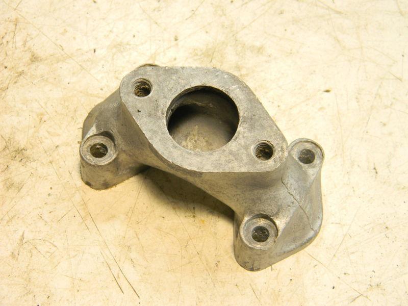 Triumph pre unit intake manifold - has upward angled carb flange