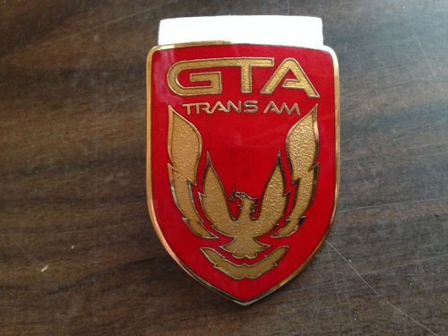 Nos, genuine oem -- header panel emblem -- red &amp; gold -- 1987-1990 trans am gta