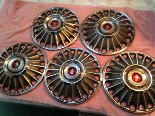 1967 mustang full set of hubcaps plus one