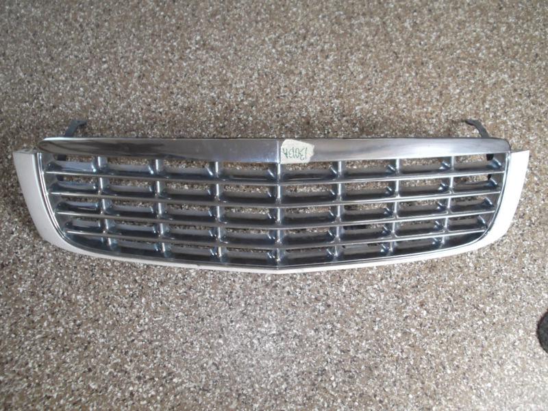 97 98 99 cadillac deville - chrome grille w/ white trim bezel