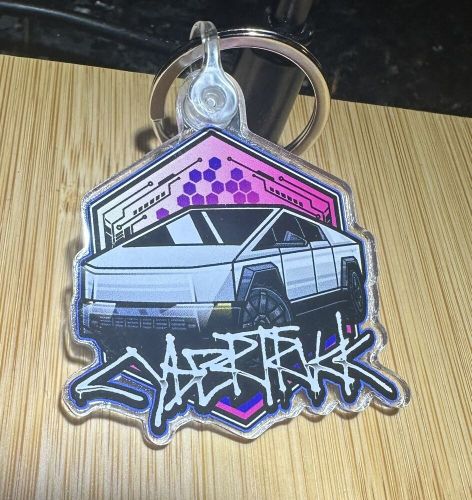 Tesla cyber truck  keychain/car badge futuristic pick your color.