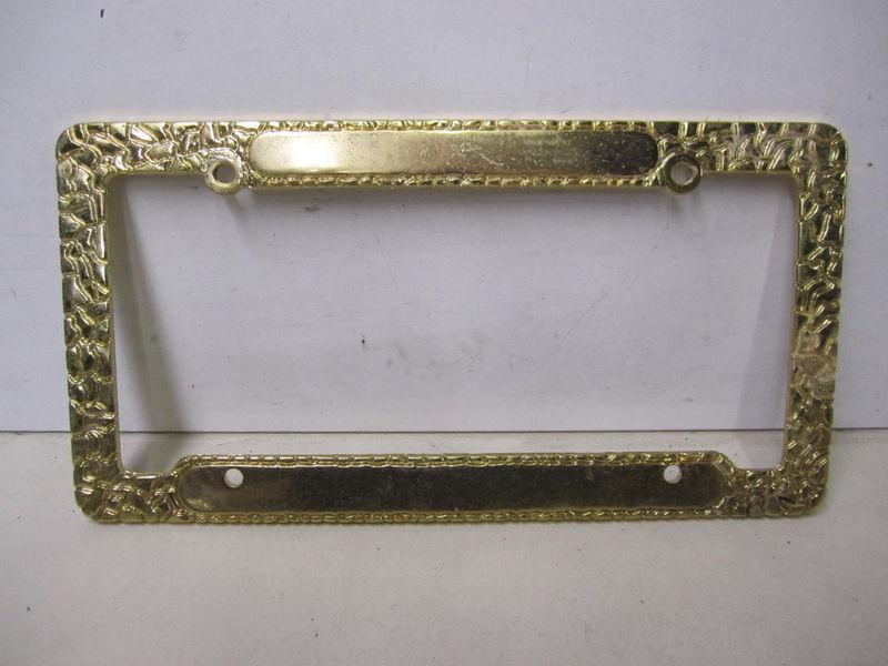 License plate frame gold metal