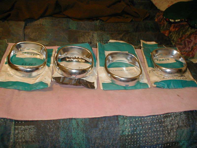 New 1965 chevrolet impala head lamp bezels...set of 4...