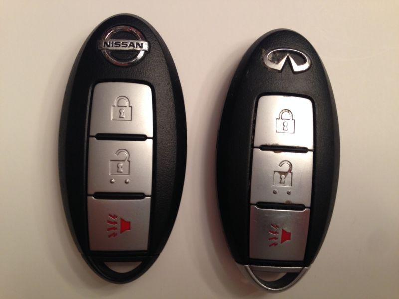 Lot of 1 infiniti and 1 nissan keyless remotes fobs - used - no reserve sale!!