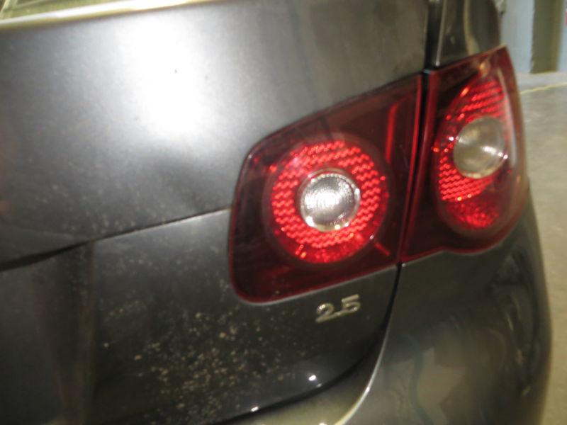 Passenger side (right) tail light 2009 volkswagen jetta, lid mounted