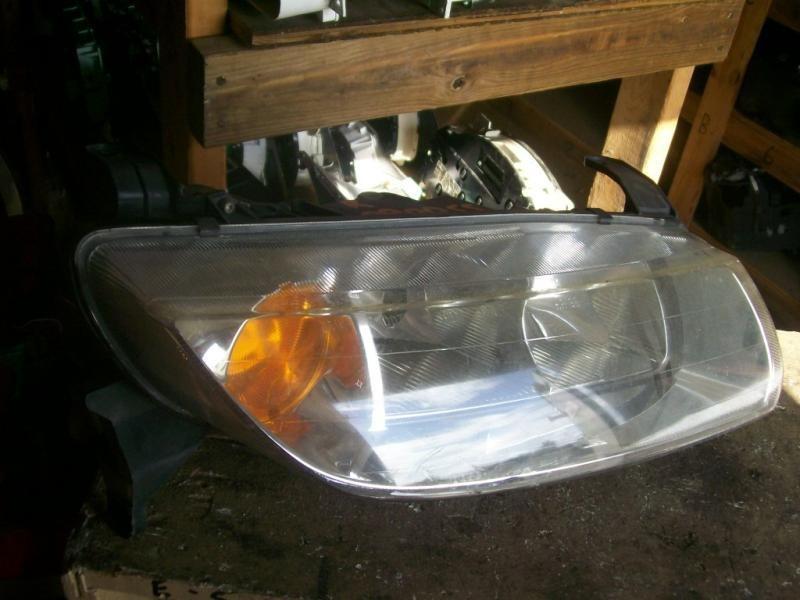 00 01 02 saturn l series sedan r. headlight 129183