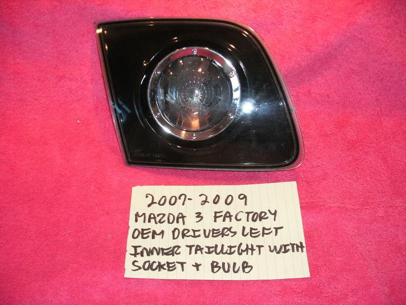 2007-2009 mazda 3 factory drivers inner brake light assembly complete with bulb