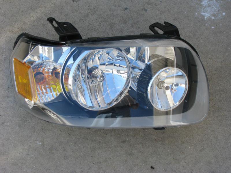 Ford escape  headlight oem 05 06 07