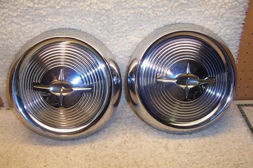 2 new old stock oldsmobile hubcaps 1950's