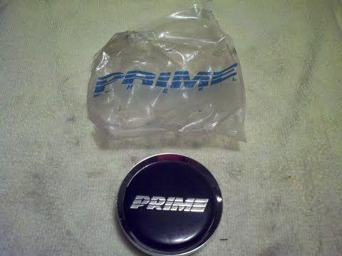 New prime alloys wheel center cap --flat center logo design   2 3/8" face dia.