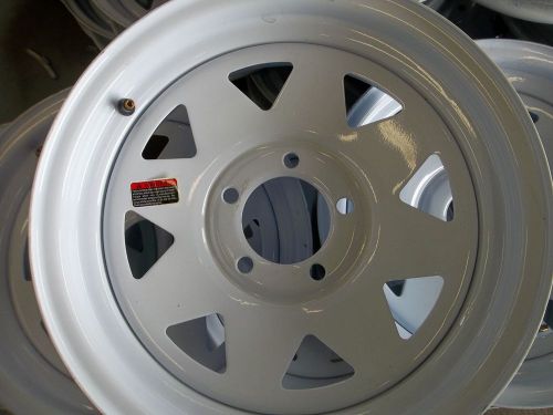 Four new 15 inch 5 on 4 1/2  bolt pattern  trailer wheels